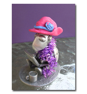 Shelly the SBI! tortoise wears her red hat and purple scarf outside